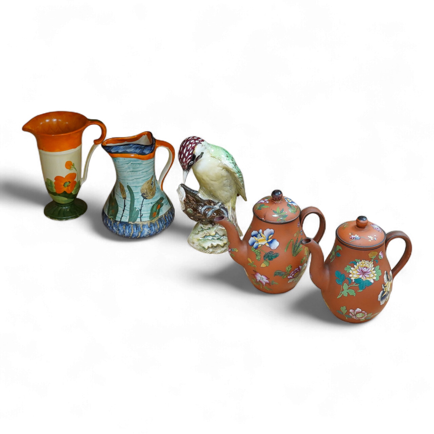 A Beswick woodpecker, two Myott jugs and two Wedgwood teapots and covers, largest 22cm